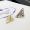 Prada Symbole Earrings In Metal Gold/White