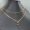 Prada Triangle Logo Pendant Two Layer Necklace in Metal Gold/Black