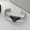 Prada Enamel Symbole Logo Cuff Bracelet In Metal Silver/Black