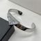 Prada Enamel Symbole Logo Cuff Bracelet In Metal Silver/White