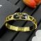 Prada Oval Enamel Logo Cut-Out Bangle Bracelet In Metal Gold/Black