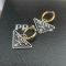 Prada Symbole Pendant Hoop Earrings In Metal Gold/Black
