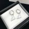 Prada Triangle Enamel Logo Earrings In Metal Silver/White