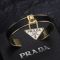 Prada Triangle Logo Charm Cuff Bracelet In Metal and Leather Black/Gold