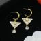 Prada Triangle Logo and Crystal Drop Earrings In Metal Gold/White