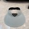 Prada Triangle Logo Visor Hat in Cotton Light Grey