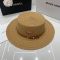 Prada Triangle Logo Wide Brim Sun Hat in Raffia Brown
